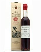 Flaske Castarède 1940 årgangsarmagnac med bagetiket og dyb ravfarve
