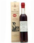 Flaske Castarède 1942 årgangsarmagnac med bagetiket og dyb brun farve