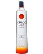 Ciroc Peach flaske i orange toner glas med sølvfarvet etiket