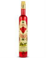Søjleformet flaske Corralejo Tequila Añejo med mørk ravfarvet væske og farverig etiket