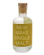 Lille whiskyflaske med new make destillat fra Færøerne