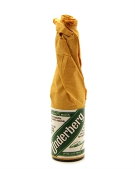Enkelt miniatureflaske Underberg indpakket i gult papir