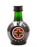 Lille rund miniatureflaske Unicum med rødt kors på etiketten