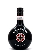 Rund mørkegrøn flaske Unicum med rødt kors på etiketten